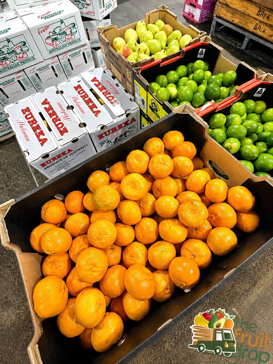 Sydney Markets mandarins, limes and pears in trade boxes