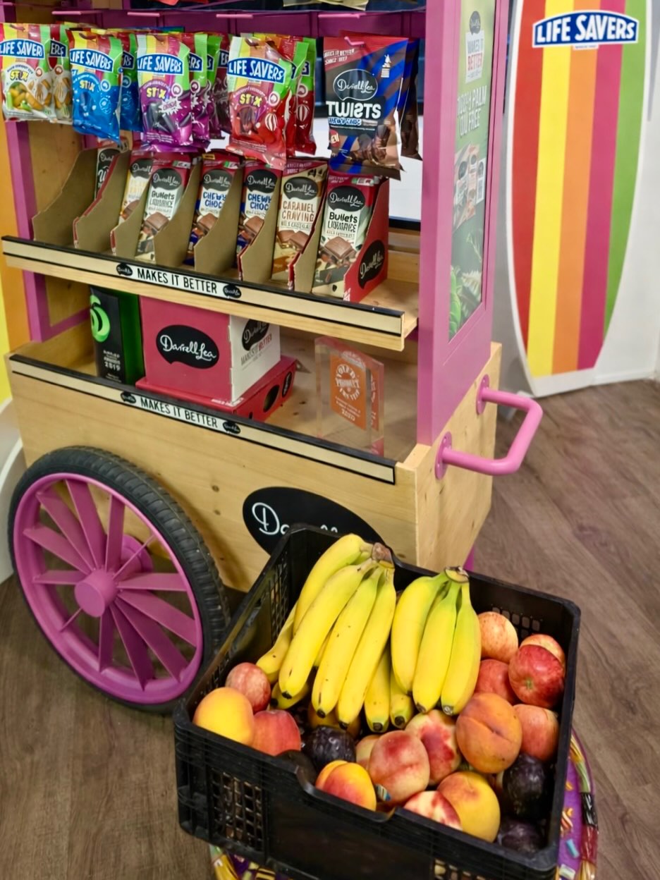 Workplace fruit crate beside the Darrell Lea cart